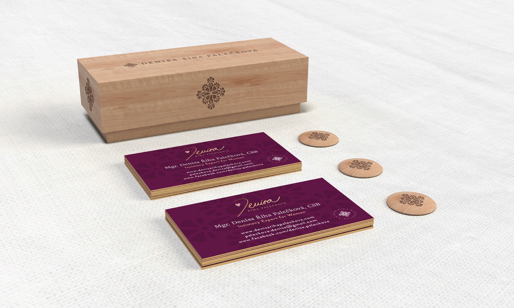 Denisa Riha Paleckova brand collateral with engraved wooden box, business cards, and wooden brand tokens